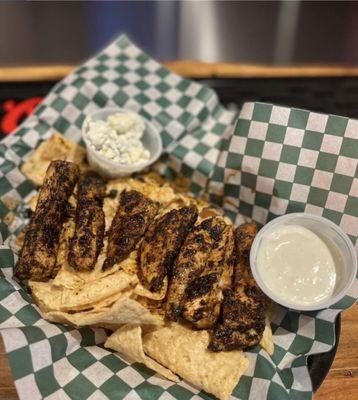Fire sticks, tender chicken with our signature spicy house rub served over tortilla chips with blue cheese crumbles.