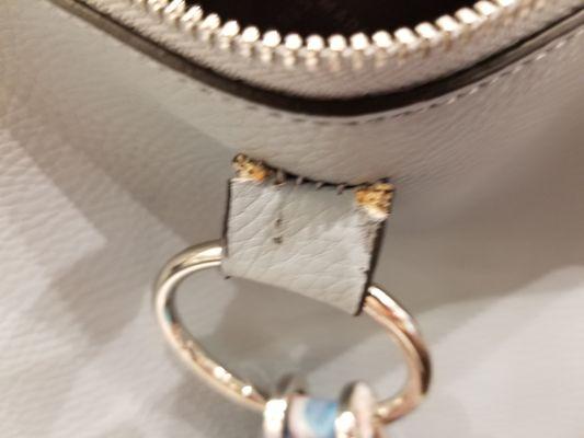 Handle pulling away from purse after less than a week of use.