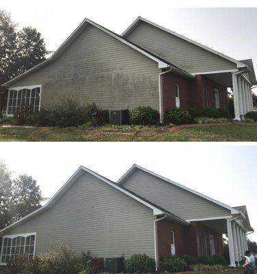 Soft washing the siding of a house
