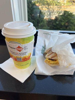 Chai Latte and egg and bacon breakfast sandwich