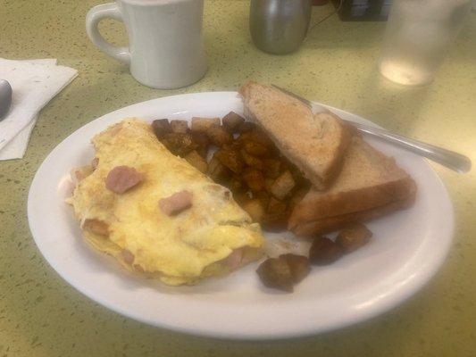 Ham and cheese omelette with hash browns.