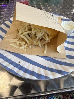 Stuffed fried chicken and cheese arepa