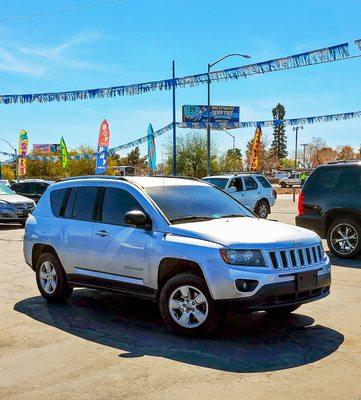 Silver JEEP Compass ready to roll. Daily and weekly specials