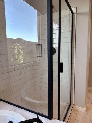 Classic black and white tile shower