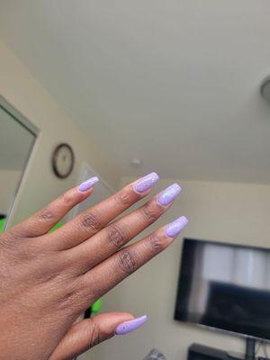 Beautiful purple nail polish and glitter nail polish.