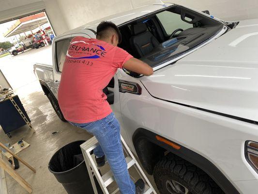 Preparing a vehicle for a windshield installation.