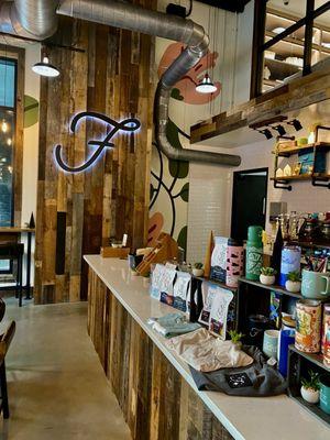 interior looking at a rustic wall with the F logo