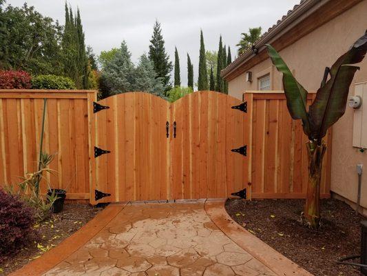 Custom fence and arched double gate with some of the best redwood around