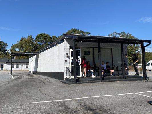 Outside of business with entrance in the front, drive through on the left and plenty of parking (can't be seen on the picture)