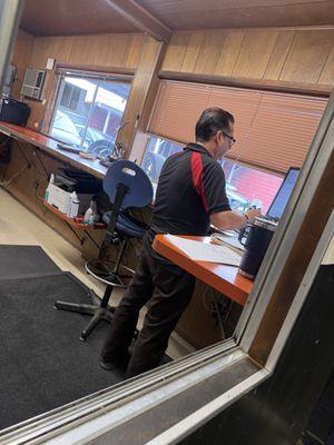 juan at the front desk. the dude who likes to touch the customers, yell and curse at them.