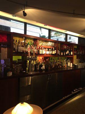 Hotel Bar 4 seasons lots of tables small bar. Nice bartender