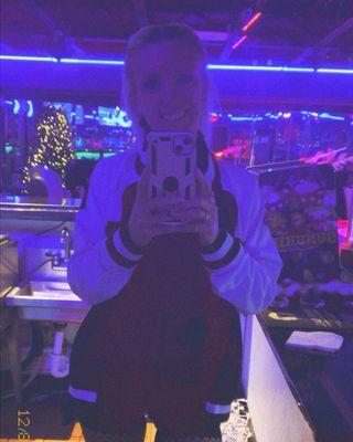 The bartender representing the Jaguars and entertains her guests.