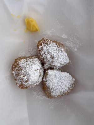 One order of calas (a style of rice "beignet") that were sold primarily by people of color. it comes with a little dollop of lemon curd..