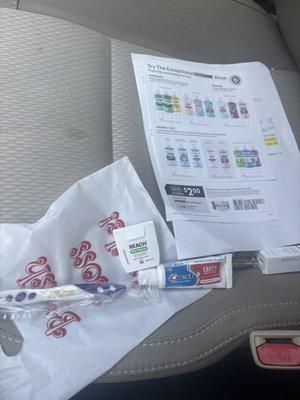 Toothbrush bag along with some samples and coupons for mouthwash