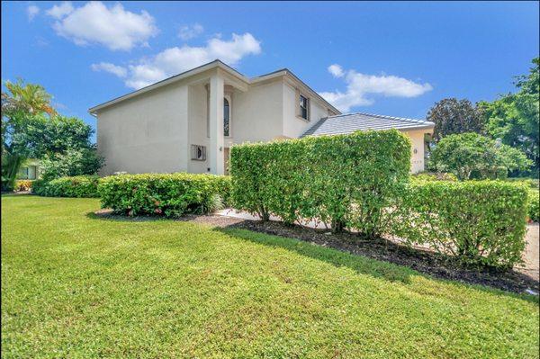 The house before new mulch was placed