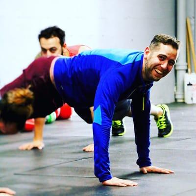 Look at that smile! Push-ups are fun!