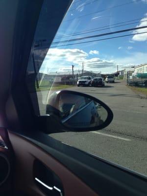 Cops sitting on the side of the road instead of directing traffic