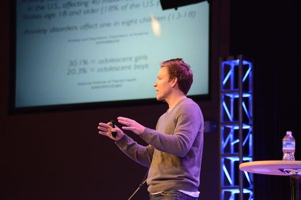 Speaking at a conference.