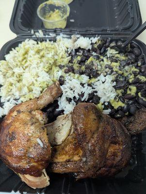 1/2 chicken with rice and beans. I poured the green sauce on for an additional kick.