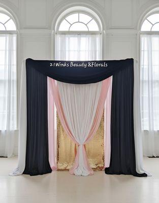 Pink and shimmer draping backdrop great focal point to brighten any room. Add florals, uplighting or fairy lights.