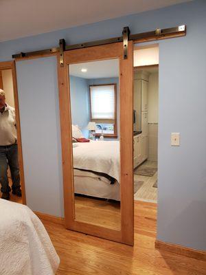 A full length mirror incorporated into this master suite #BarnDoor