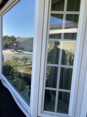 Warping bottom trim of Bay window installed by Colima Glass.