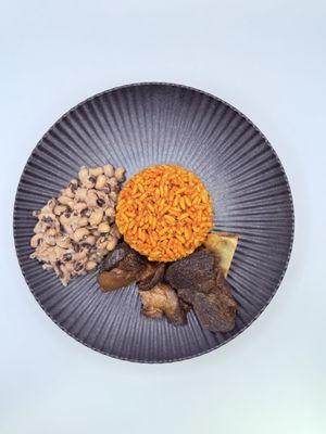 Jollof rice, parboiled beans & fried beef