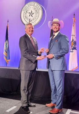 Newsletter Committee Member Kenneth Ferguson accepts Best Newsletter Award on behalf of the Denton County Bar Association!