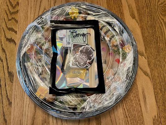 Delivered sushi tray condiments and utensils