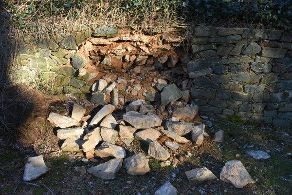 One of four weak or failed retaining wall sections.