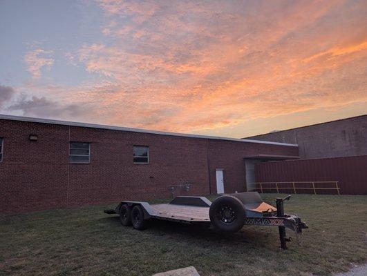 Our 20 foot 14k flatbed car hauler back from a long trip enjoying a beautiful sunset.