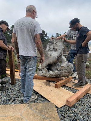 Moving landscape boulders to their new home, no machines allowed.