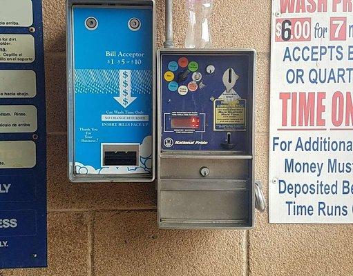 Machine on left, for bills, coins go in machine on right.