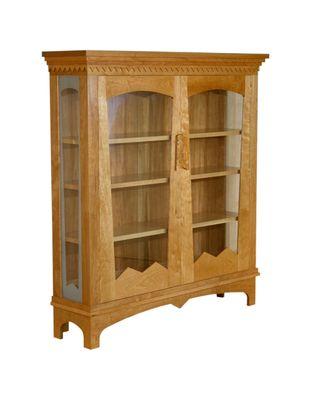 A customer designed this bookcase for his prized book collection and I built the cherry case.