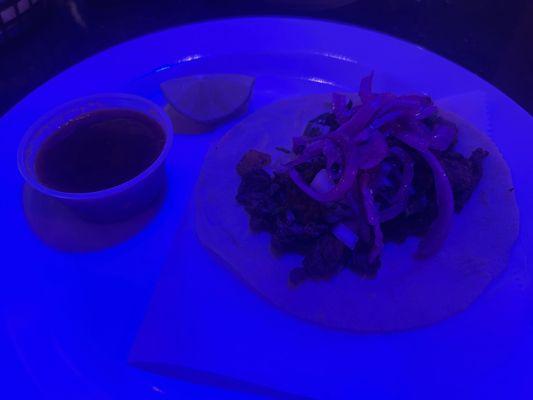 Carne asada taco, the blue light above me threw off the picture.