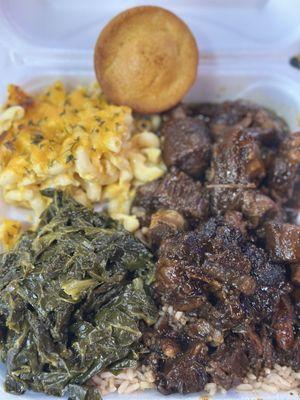 Oxtail's rice w/peas, collard greens, Corn Bread with Mac and Cheese