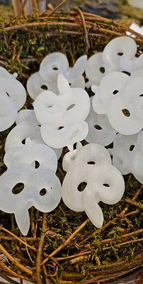 Selenite carved snakes resting in a nest at ordinary magic Savannah