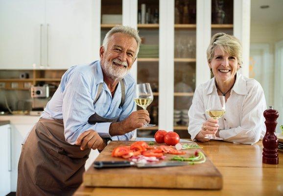 A couple enjoying a glass of wine during retirement
