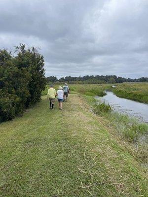 Walk along the canal to view massive Orange Lake