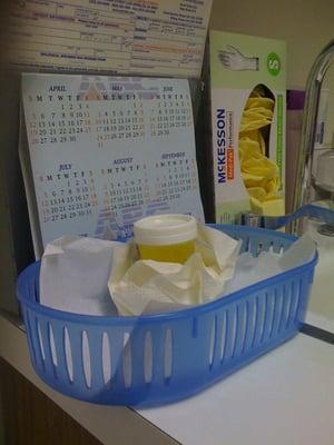 Someone elses pee cup dropped off in a room