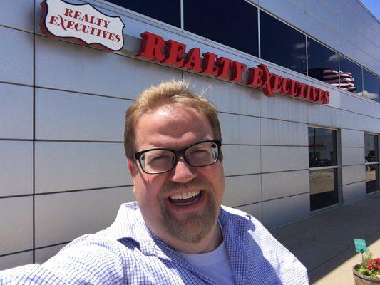 Selfie in front of our new sign!