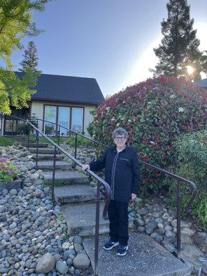 My mom by her brand new hand rails.