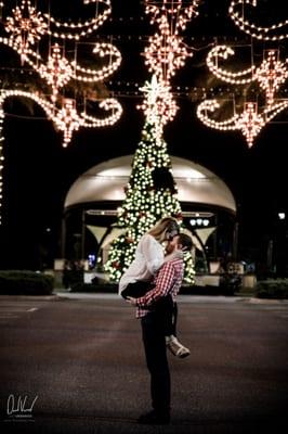A couple photoshoot for a anniversary is taken during the holidays in the Town of Tioga Town Center.