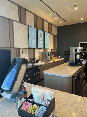 View of the work space, very clean, self serve napkins and condiments