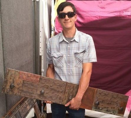 Picture of Nathan with our new coat rack at the San Ramon Art & Wind Festival!