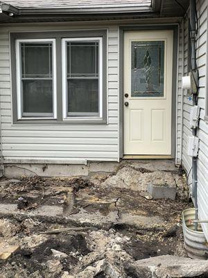 Post-wooden porch removal. Discovered damaged cinderblock foundation.