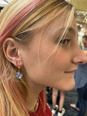 My oldest getting her 2nd set of earlobe piercings (after pic)