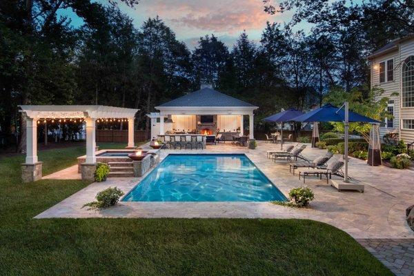 Landscape design and build. Patio, pool and pavilion with a fireplace.