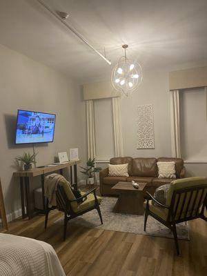 No dining table but the table under the TV has two stools. That should be pulled out to use.