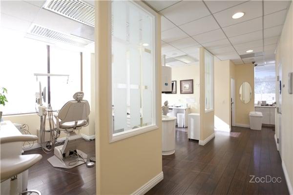 Spacious treatment rooms with TVs and wireless headphones